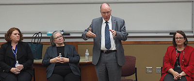 Photograph: Panelists speaking to students at Washburn Law about Tim Carmody.
