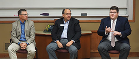Photograph: John Donley, Greg Krissek, and Joseph Aker presenting at Washburn Law.
