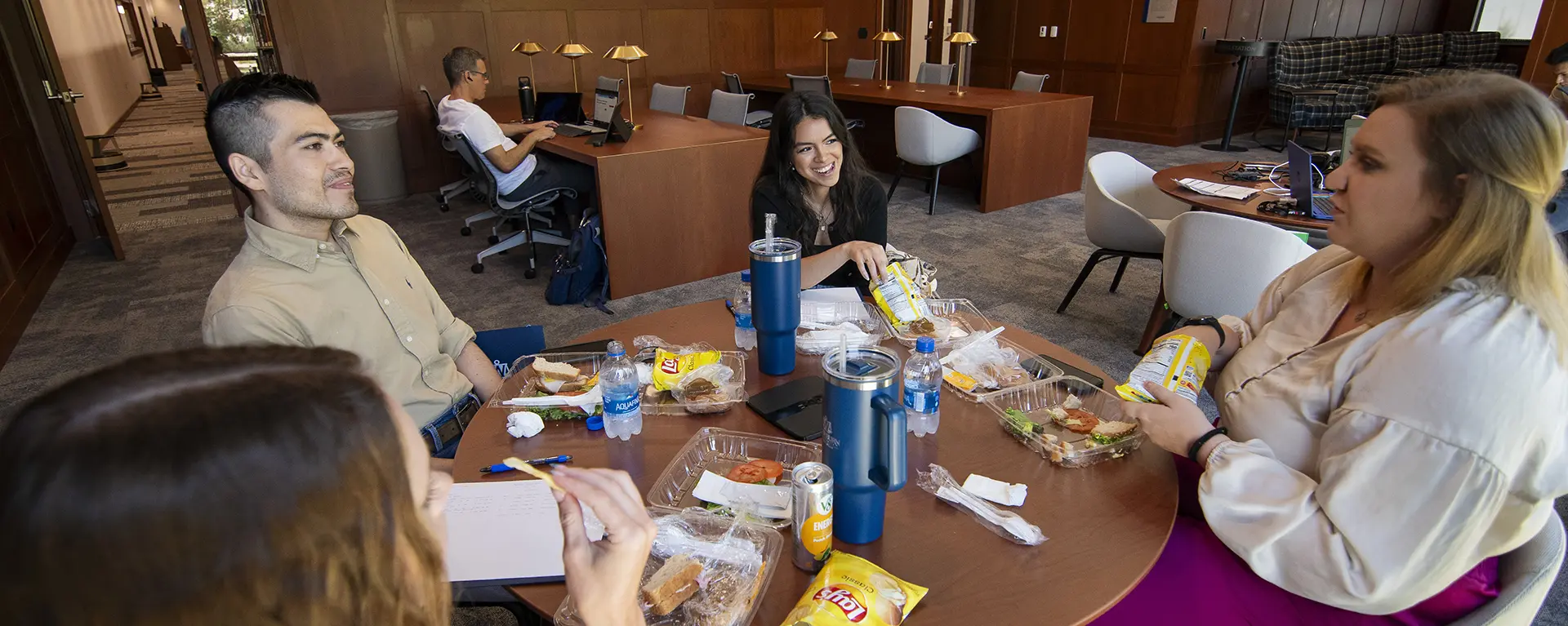 Students eat lunch together in the reading room.