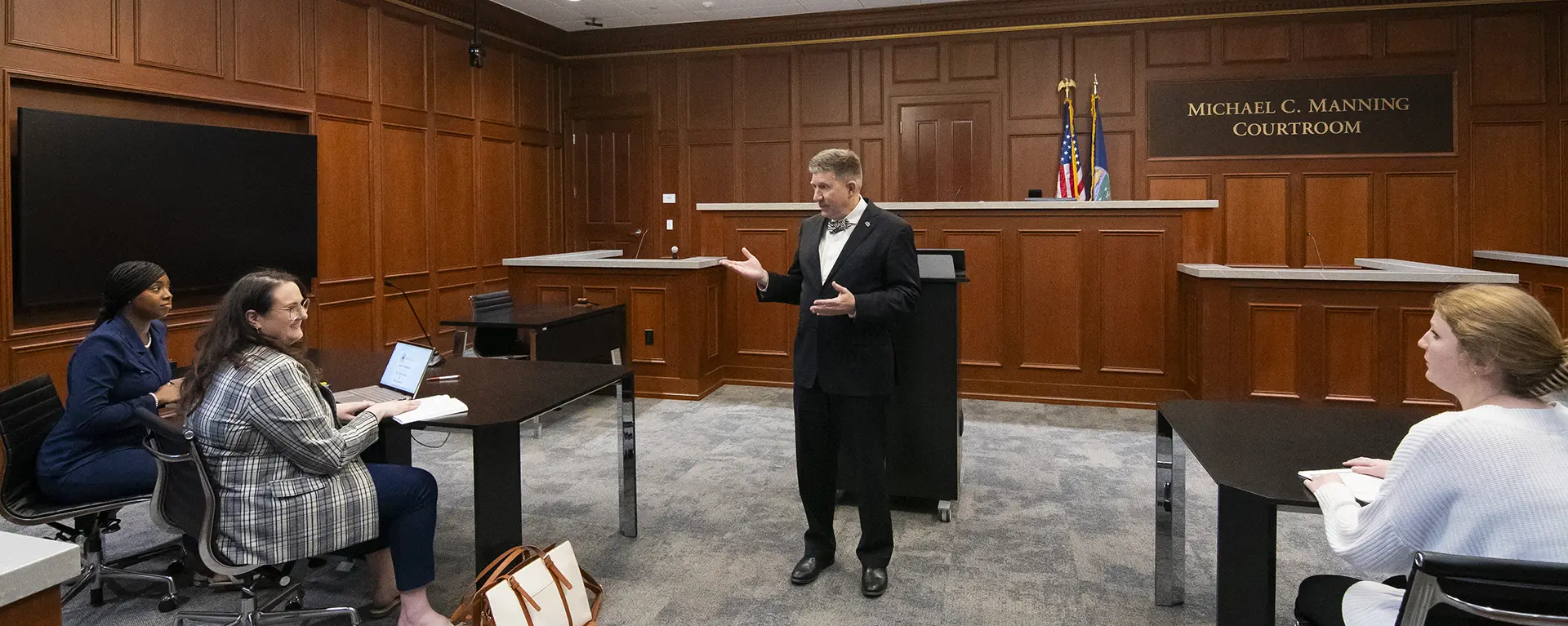 Washburn Law Dean Jeffrey Jackson coaches students in advocacy law in the trial courtroom.