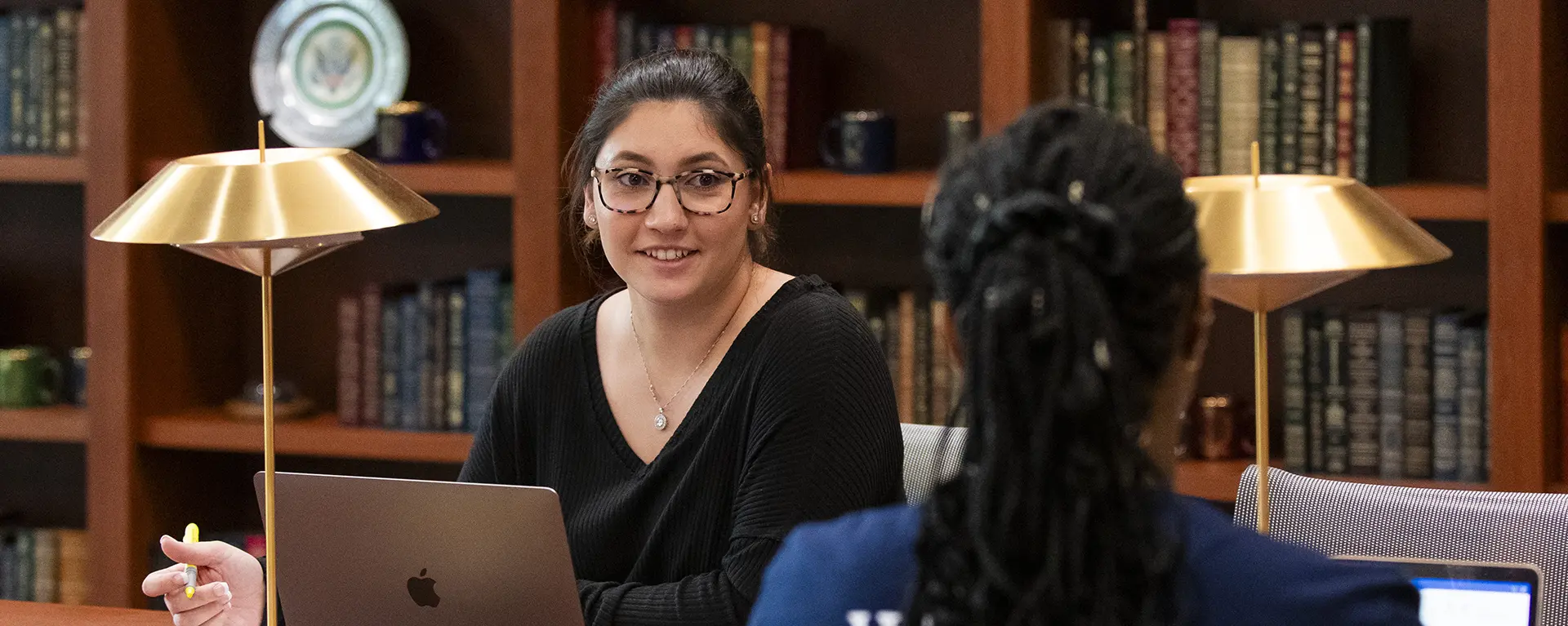 A student takes a break from studying in the reading room. 