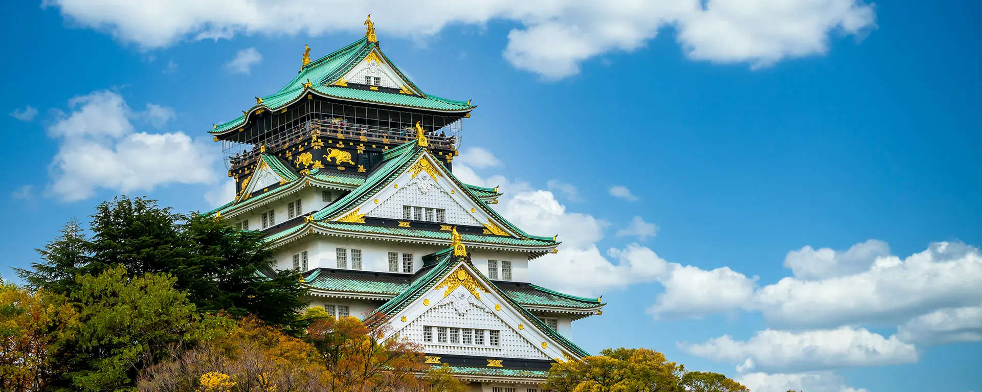 Osaka Castle against blue sky. 