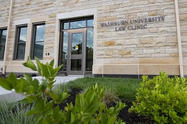 The exterior of the Washburn Law Clinic on a sunny day. 