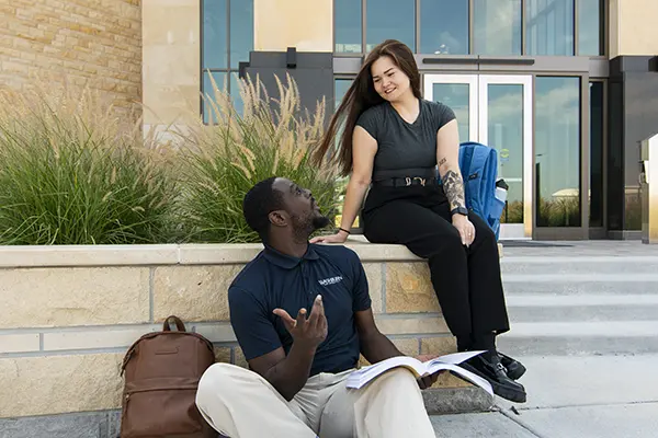 A law student talks with a friend.