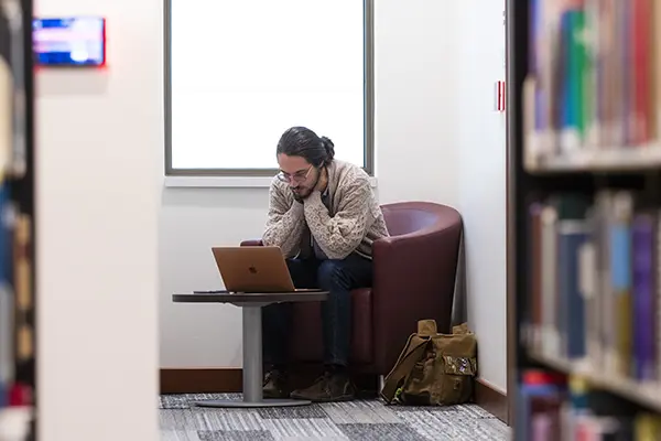 A student studies in the library.