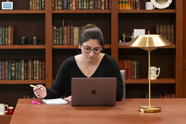 A student studies in the law school reading room. 