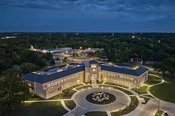 Robert J. Dole Hall as seen from above at night.