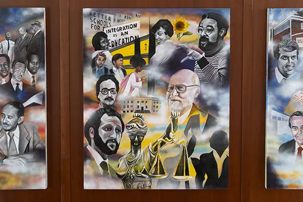 The third panel of the mural features more colorful portraits of faculty members involved with the case.