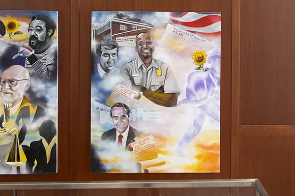 The fourth panel of the mural is more colorful and features depictions of park rangers and Sen. Bob Dole.