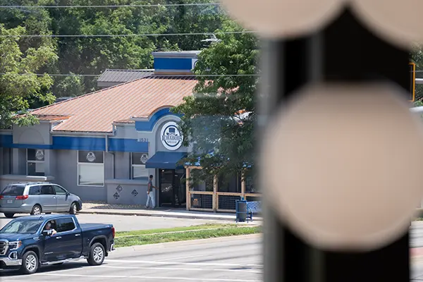 A person walks into Ichabod's Grille.