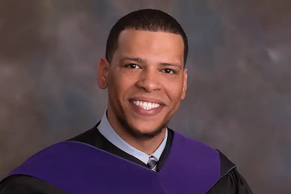 Felix Hill in graduation regalia.