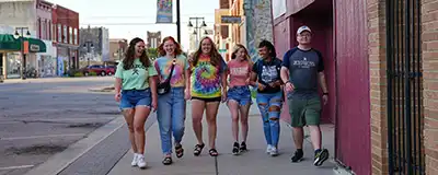 NOTO district Topeka with students walking down street