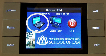Photograph: Podium touchpad showing icon to press to output laptop display to the projector.